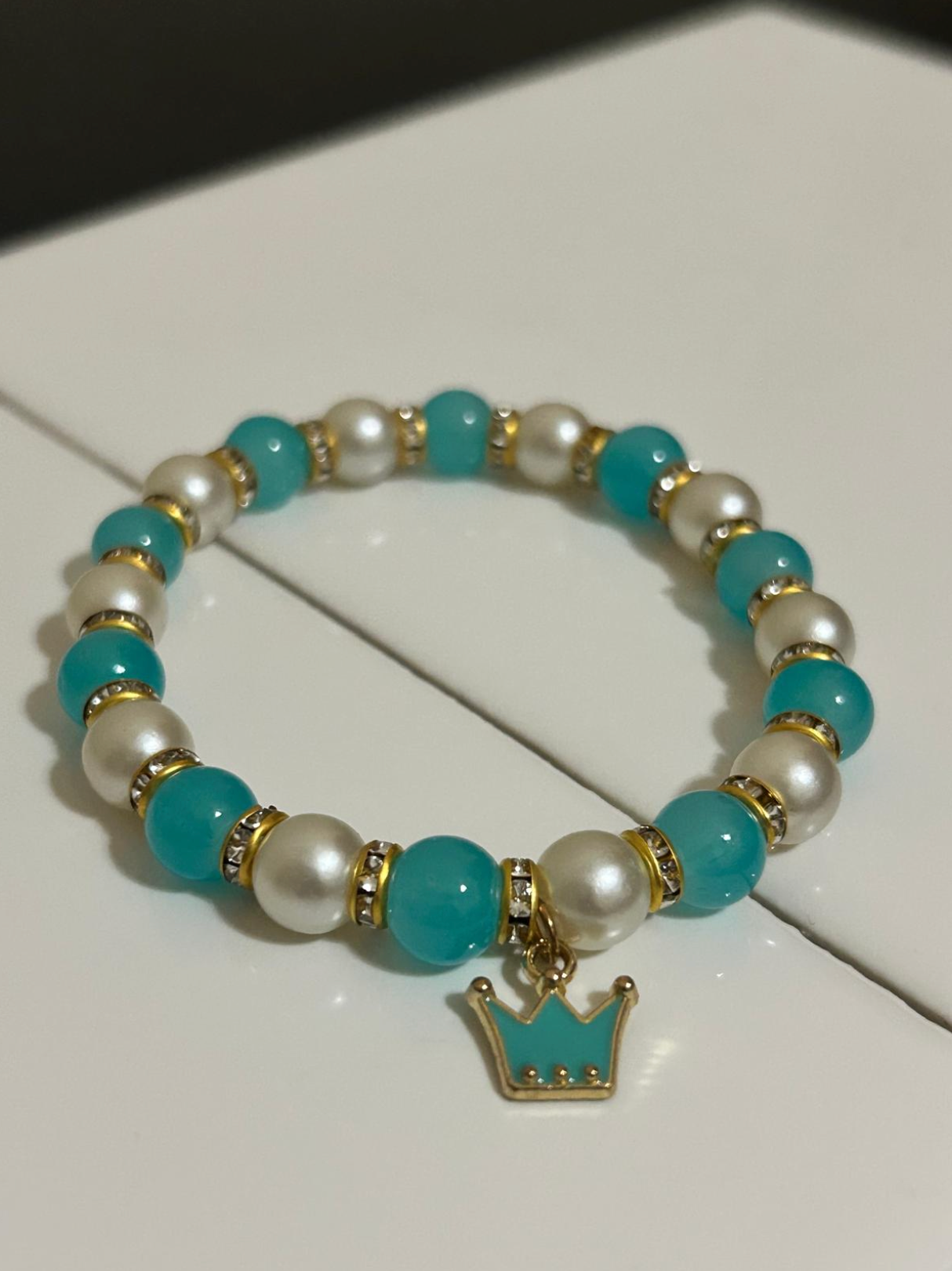 Beaded Bracelet with Mixed Colors, A charm, and intervals