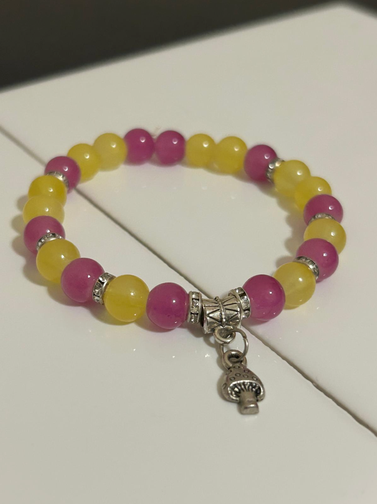 Beaded Bracelet with Mixed Colors, A charm, and intervals