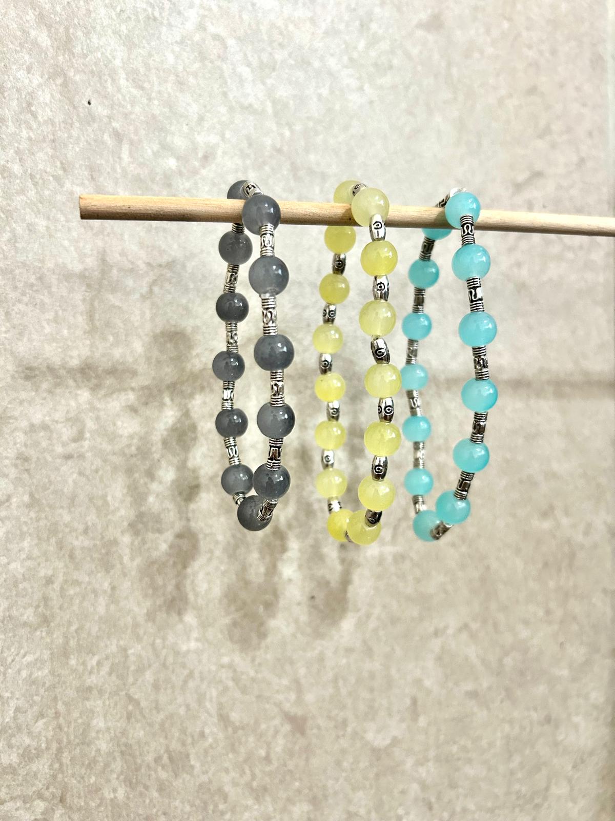 Aqua Blue, Light Yellow, and Grey Bracelet set with Silver engraved Intervals