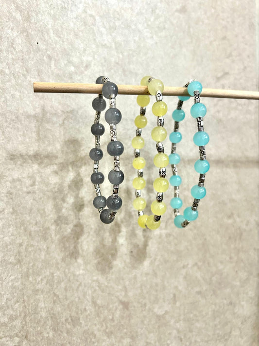 Aqua Blue, Light Yellow, and Grey Bracelet set with Silver engraved Intervals